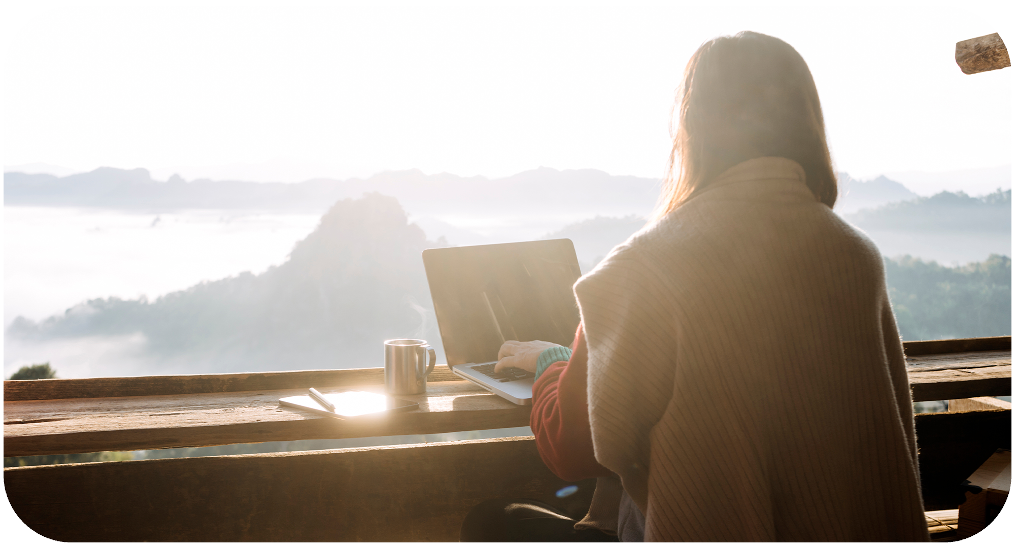 Person overlooking the vast view whilst working remotely